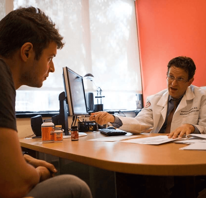 Doctor consulting with patient in medical office